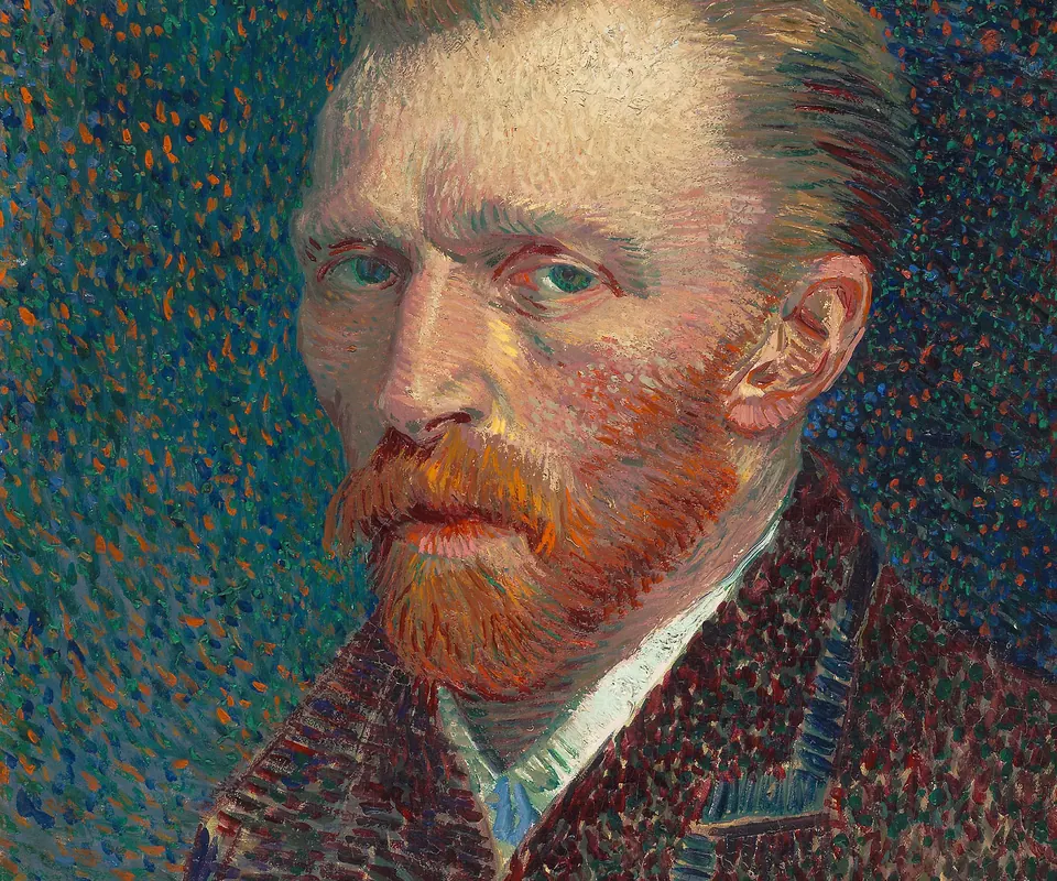 Detail of Self-Portrait by Vincent van Gogh. Van Gogh faces the viewer in a self-portrait built from short colored strokes.