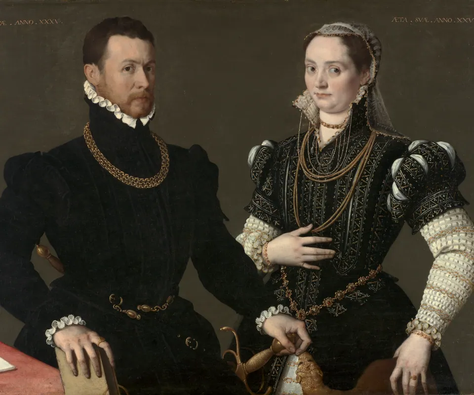 Detail of Portrait of a Couple by Unidentified artist. A richly dressed man and woman stand together with jewelry and a sword.