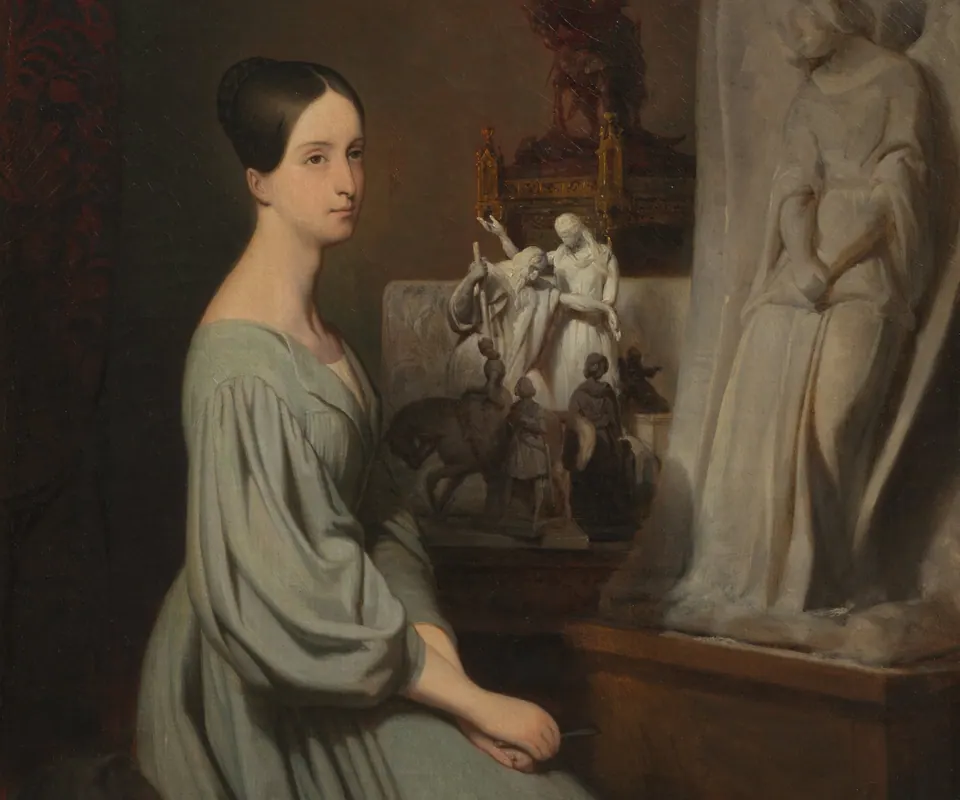 Detail of Princess Marie d'Orléans in Her Studio by Ary Scheffer (Dutch, 1795–1858). Princess Marie d’Orléans holds a sculptor’s chisel in a studio containing her works.